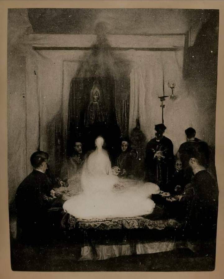 an old black and white photo of a bride surrounded by other people sitting at a table