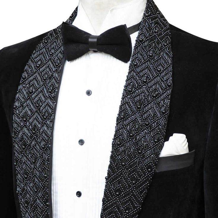 Package Includes: 1 x Jacket - 1 x Pant

Step into the spotlight with our exclusive Black Velvet Tuxedo, adorned with eye-catching crystal bead details for an extra touch of elegance. This tuxedo combines the timeless charm of velvet with a hint of sparkle, perfect for making a statement at any high-end event.

 	Fabric: Velvet
 	Lining Fabric: Silk
 	Pattern: Plain
 	Buttons: Black Satin Fabric
 	Construction: Half Canvas
 	Seasonality: All Season
 	Jacket: Shawl Lapel,  Crystal Bead On Lapel, Formal Fitted Blazer With Rhinestones, Fitted Rhinestone Blazer For Formal Occasions, Elegant Evening Blazer With Rhinestones, Elegant Fitted Blazer With Rhinestones, Elegant Sequined Suits For Evening, Elegant Outerwear With Sequins And Notch Lapel, Elegant Notch Lapel Outerwear With Sequins, Elegant Black Blazer With Rhinestones, Elegant Sequined Notch Lapel Outerwear