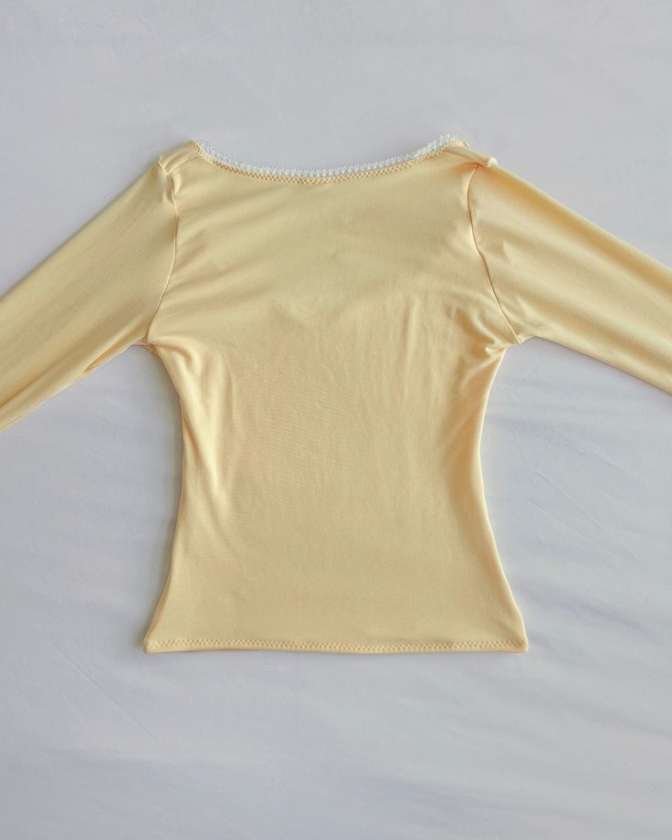 * All preorders for this item ship within 1-2 weeks! Handmade light yellow long sleeve top Super soft and stretchy Sweetheart neckline & full length fit Double layered front and back bodice for extra coverage and shape Model is wearing a size S Free U.S. shipping! Yellow Long Sleeve Shirt, Room Items, Yellow Clothes, Yellow Long Sleeve, Butter Yellow, Handmade Lighting, Yellow Top, Simple Trendy Outfits, Yellow Sweater