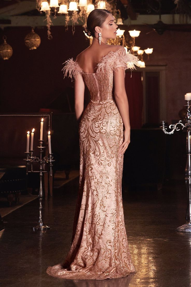 Designed for your next gala event or special occasion. This mermaid gown is an empowering fit with a glitter scroll print and feathered off the shoulder detail. A deep plunging neckline fades into an illusion waistline and sheer covered back. Evening Gown Hairstyles, Prom Dresses With Feathers, Rose Gold Evening Gown, Rose Gold Prom Dress, Gold Corset, 2023 Prom, Gold Dresses, Gala Event, Cinderella Divine