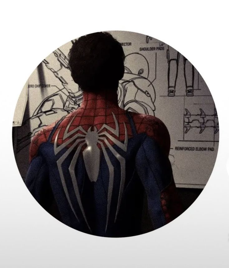 the back of a spider - man's body in front of a drawing board