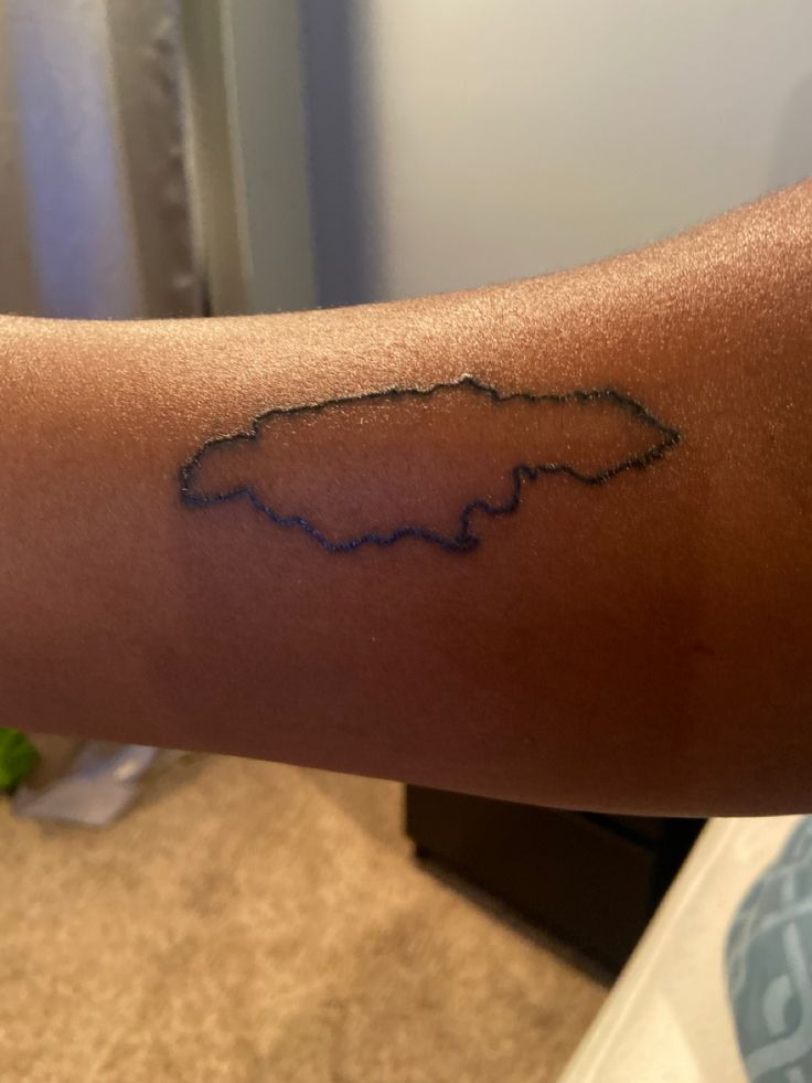 Island outline Jamaican Symbols Tattoo, Jamaican Island Tattoo, Jamaica Island Tattoo, Who Jah Bless No Man Curse Tattoo, Jamaica Tattoo Ideas Men, Jamaica Inspired Tattoos, Jamaican Tattoos For Women, Jamaica Tattoo Ideas, Jamaica Tattoo