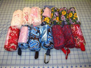 several different types of umbrellas laid out on a cutting board