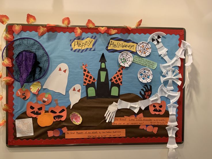 a bulletin board with halloween decorations on it