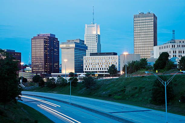 the city skyline is lit up at night