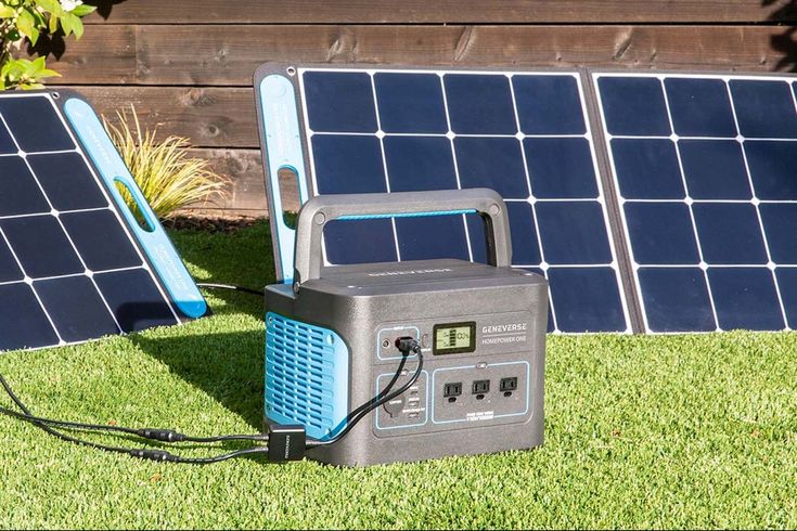 two solar panels and an air conditioner in the grass