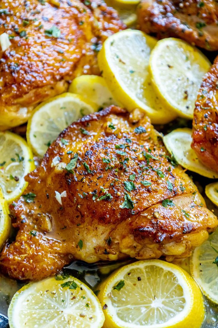 chicken with lemons and parsley on the side