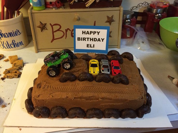 a birthday cake that is shaped like a monster truck