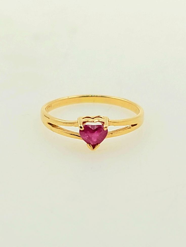 Beautifully vintage 1990s handcrafted 14K yellow gold ring. There is a natural ruby placed in the center of this ring which is heart shaped. Split Shank ring This gorgeous ring is a great gift idea for Valentine's Day, anniversary or a birthday celebration.  Ring size: 1 1/2 (sizeable upon request) Total ruby weight approx: 0.10 ct Total ring weight: 0.7g Hallmarks: 14K HABCO Will be placed into a suitable gift box Free shipping within the U.S. Gold Heart Cut Ruby Birthstone Ring, Gold Ruby Heart Cut Ring For Promise, Gold Ruby Heart Cut Promise Ring, Formal Gold Ruby Ring With Heart Cut, Ruby Heart Gold Ring, Heart Cut Ruby Ring In Yellow Gold For Promise, Classic Heart Cut Ruby Ring In 14k Gold, Heart Cut Yellow Gold Ruby Promise Ring, Classic 14k Gold Heart Cut Ruby Ring