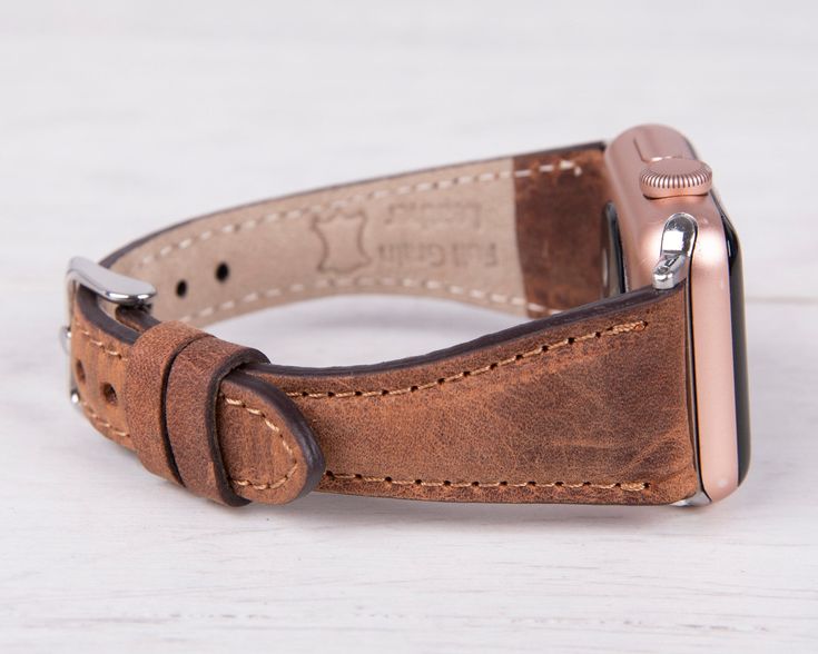 Embrace the art of handmade luxury with our antic brown leather slim Apple Watch band. Meticulously crafted from premium materials, this band offers a unique and stylish way to express your individuality. This luxurious accessory wraps twice around your wrist, adding a touch of elegance and effortless chic to your everyday style. Completely Handmade Genuine Full-Grain Leather Minimalist Slim Design Durable, Stylish & Timeless Design Stainless-Steel Buckles - Secure & Strong Compatible with all A Vintage Brown Leather Apple Watch Band, Classic Brown Rectangular Apple Watch Band, Classic Brown Apple Watch Band For Everyday Use, Vintage Brown Leather Strap For Apple Watch, Vintage Brown Adjustable Leather Strap Watch Band, Modern Brown Watch Accessories With Waxed Finish, Adjustable Vintage Brown Leather Watch Bands, Modern Brown Rectangular Apple Watch Band, Vintage Leather Bracelet Strap For Apple Watch