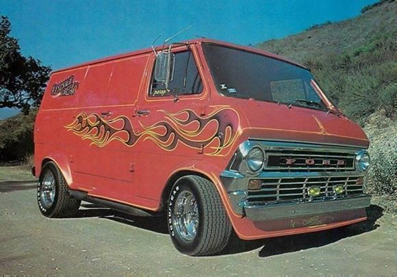 an old red van with flames painted on it