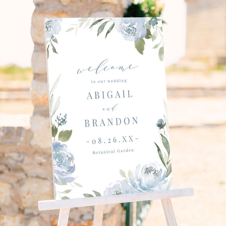 an easel with a sign on it that says, welcome to our wedding abigail and brandon