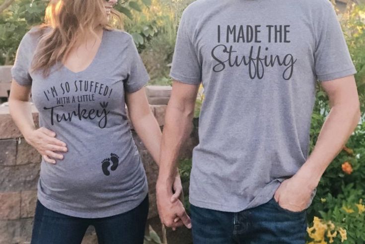 a man and woman standing next to each other wearing matching t - shirts that read i made the stuffing