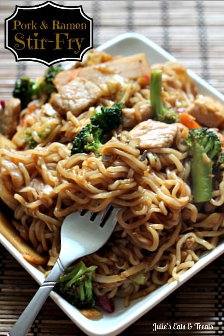 a white plate topped with noodles and broccoli