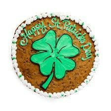 a birthday cake with a green shamrock on it