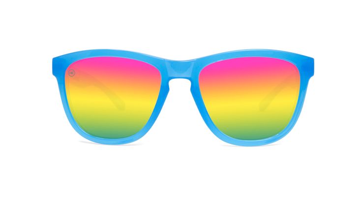 When you ask your kid what their favorite color is, is their answer every shade under the rainbow and more? Well, now they don't have to choose. Our polarized Rainbow Blues Kids Premiums incorporate pink, orange, yellow, green blue, and more in-between shades than we can count. The bright blue kids frames complement the polarized rainbow of lens colors that provide UV400 protection and will last for years to come, or at least until they can settle on a favorite color. UV400 sun protection FDA ap Rainbow Sunglasses With Uv Protection For Summer, Blue Fun Sunglasses With Tinted Lenses, Blue Tinted Fun Sunglasses, Fun Blue Tinted Sunglasses, Fun Multicolor Tinted Sunglasses, Fun Multicolor Polarized Sunglasses, Fun Multicolor Sunglasses With Gradient Lenses, Trendy Rainbow Sunglasses With Gradient Lenses, Fun Blue Sunglasses For Summer