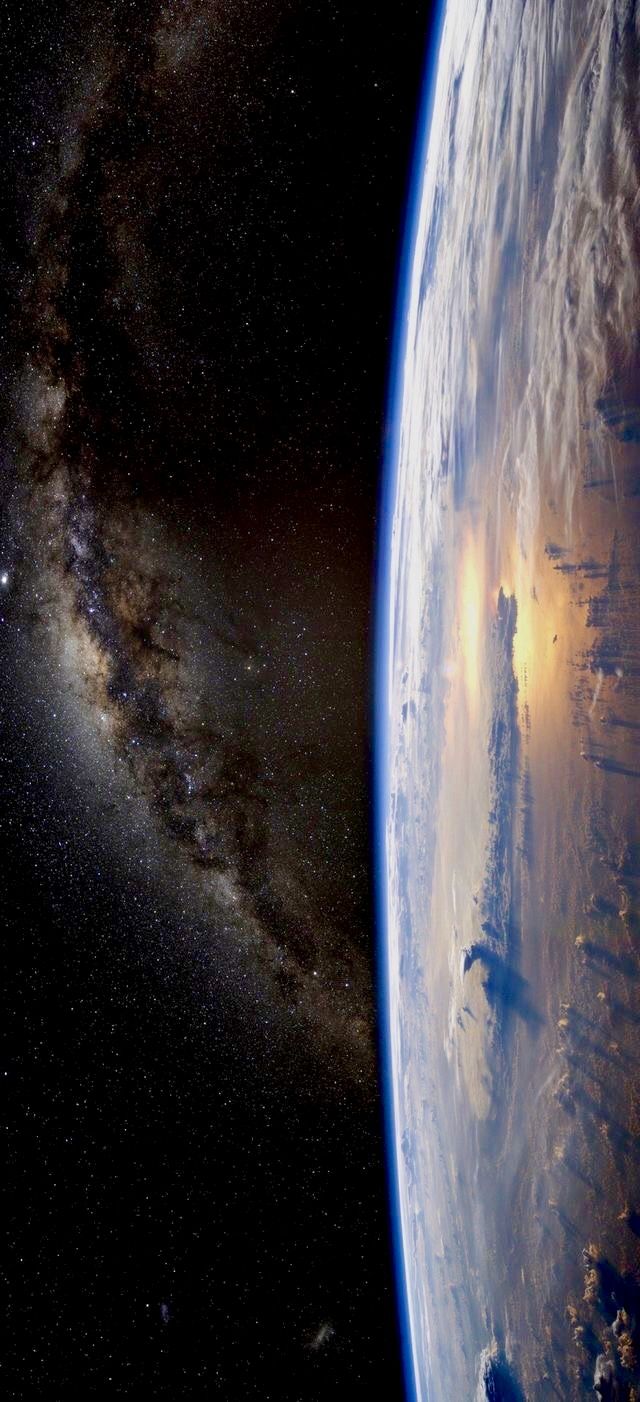 the earth's horizon is shown in this view from space, looking toward the sun and stars