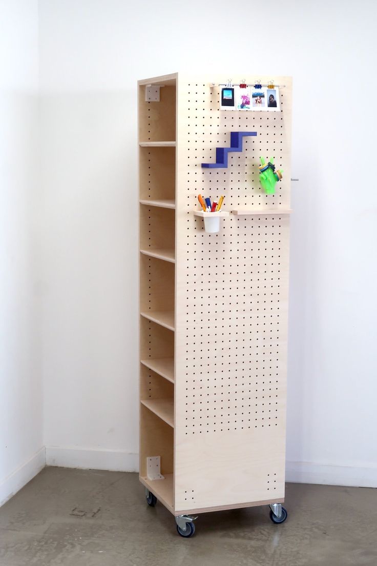 a book shelf with pegboard on the side