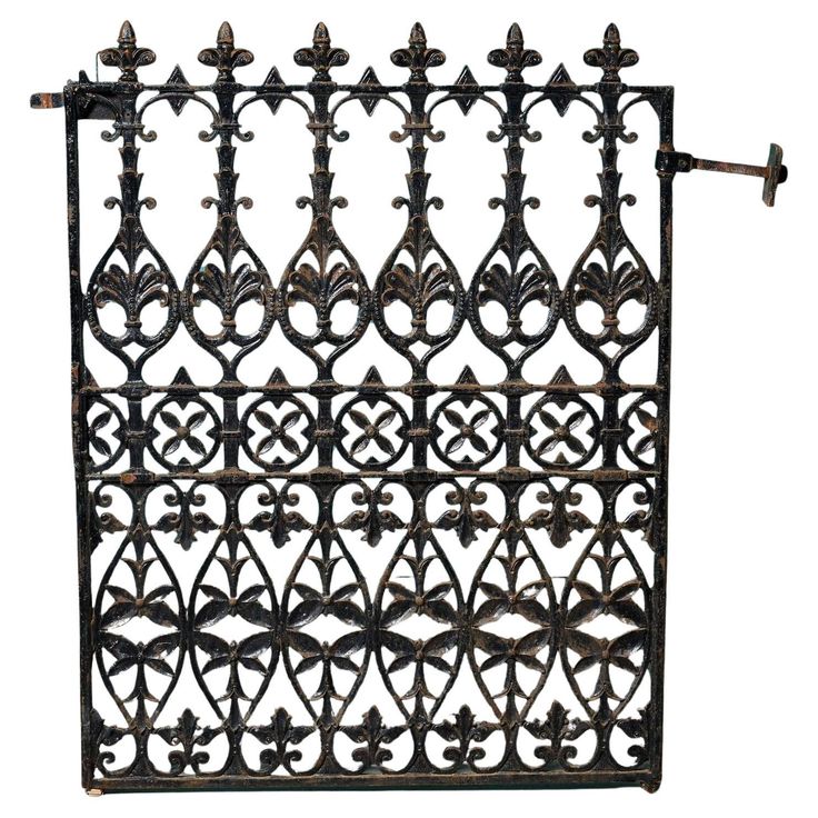 an old iron gate with ornate designs on the top and bottom, isolated against a white background