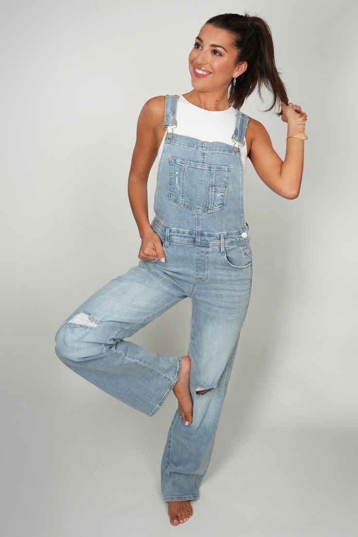 Get that classic American vibe with our Marissa overalls. The perfect fit to make them super flattering on everybody and with the perfect amount of stretch to make them crazy comfortable. Size Chart Features: bib front buckle straps pockets straight leg measurements are approximate and taken when garment is lying flat small: inseam: 31.5" medium: inseam: 32" large: inseam: 32.5" Trendy Medium Wash Overalls With Adjustable Straps, Trendy Light Wash Straight Leg Overalls, Medium Wash Denim Jumpsuit With Adjustable Straps, Trendy Medium Wash Bottoms With Adjustable Straps, Casual Jeans With Adjustable Straps, Casual Spring Jeans With Adjustable Straps, Casual Jeans With Adjustable Straps For Spring, Casual Denim Overall Jumpsuit With Belt Loops, Casual Bib Front Bottoms With Adjustable Straps