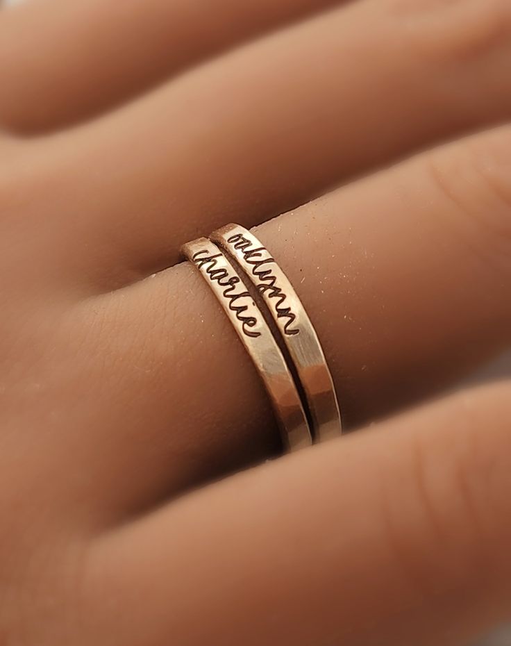 This personalized stacking ring features a unique and stylish handwriting font or serif font, adding a personal touch to your jewelry collection. Handmade with care, each ring is crafted with 14k gold filled or fine silver materials for a luxurious look and feel. Make a statement with this modern and customizable piece. Name Engraved Rings, Minimalist Personalized 14k Gold Engraved Ring, Personalized Minimalist 14k Gold Engraved Ring, Minimalist 14k Gold Engraved Personalized Ring, Minimalist Personalized Engraved 14k Gold Ring, Minimalist Engraved 14k Gold Ring, Minimalist Personalized Stackable Open Rings, Personalized Gold Sterling Silver Ring, Hand Stamped 14k Gold Engraved Ring