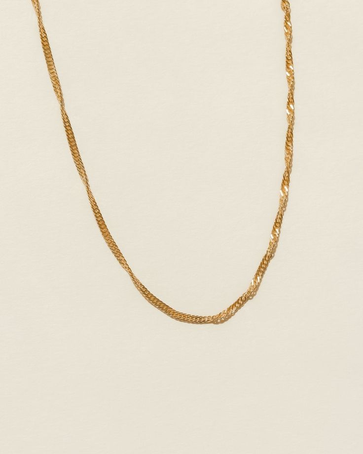 The Laurelle chain is one of the most classic pieces in our collection. Unbelievable beautiful and simple, the unique twist on the chain catches the light from many angles. Once you see it, you can't look away. …………………………………. D E T A I L S • Chain length comes in 16, 18 or 20 inches • Chain thickness measures 2 mm • Tarnish-resistant, waterproof,safe for sensitive skin • Spring clasp • 18K Gold Filled Gold Lariat Figaro Chain Necklace, Gold Figaro Chain Lariat Necklace, Elegant Formal Gold Chain Rope Necklace, Elegant Formal Gold Rope Chain Necklace, Elegant Twisted Necklace With Adjustable Chain, Gold Twisted Rope Chain Necklace, Elegant Gold Adjustable Rope Chain Necklace, Elegant Gold Rope Chain Necklace With Adjustable Chain, Gold-plated Rope Chain Necklace