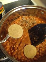 a pot filled with beans and other food