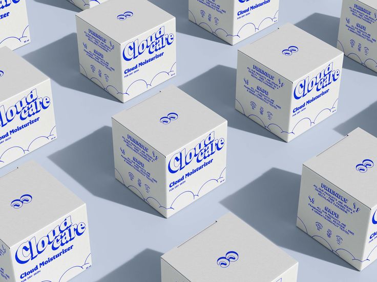 many white boxes with blue logos are stacked on top of each other in the shape of cubes