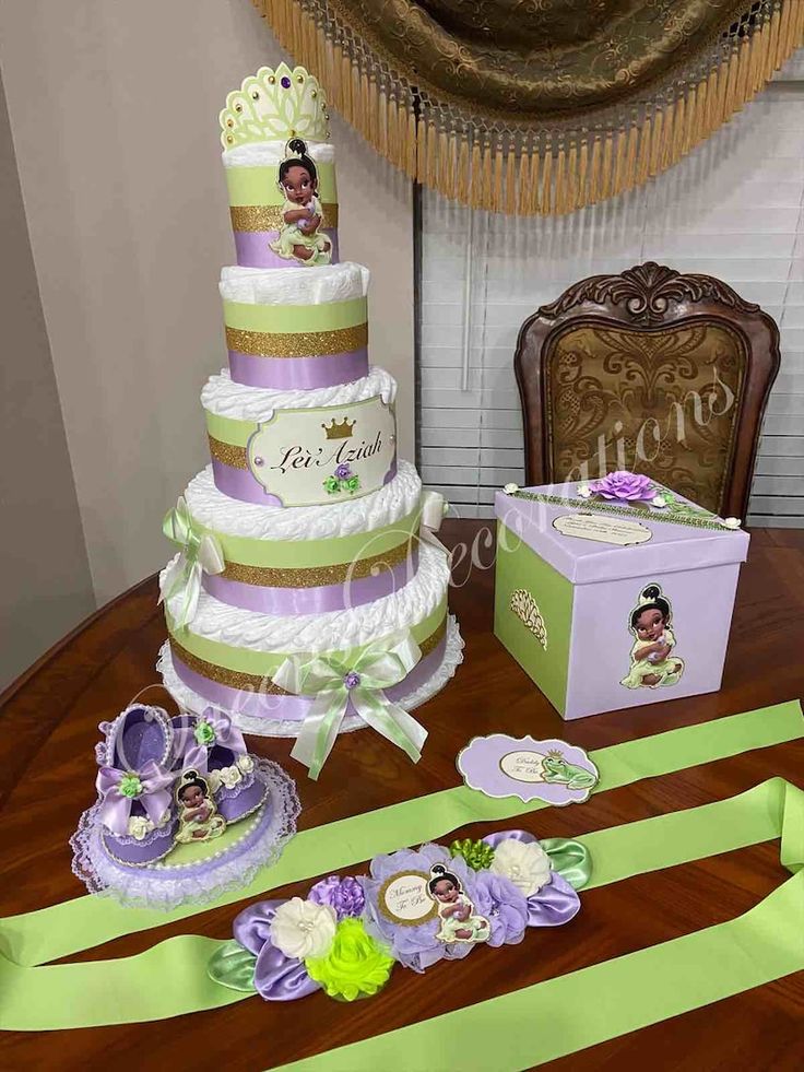 a table topped with lots of different types of cakes and ribbons on top of it