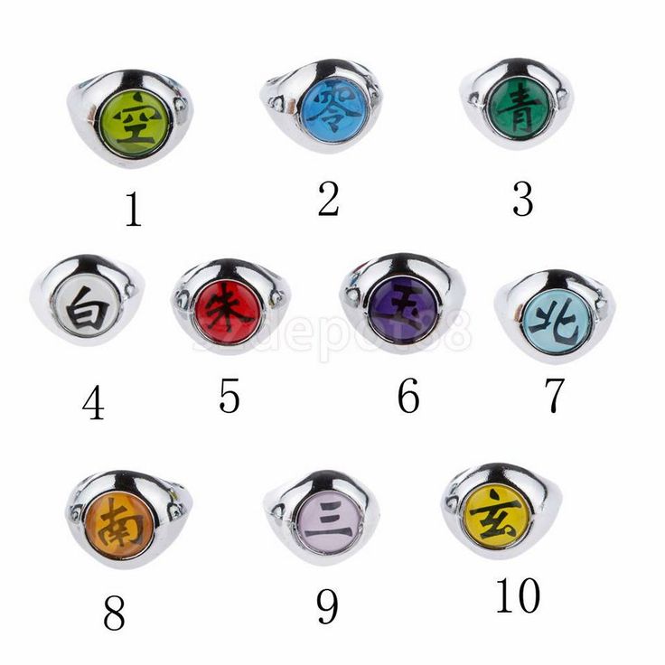 an assortment of rings with symbols in different colors and sizes, all on white background