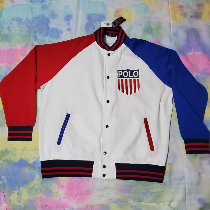 New In Unused Condition With Tags Size Small.. Polo Ralph Lauren Shield Kswiss Chariots Usa Jacket.. White Patchwork Varsity Jacket For Streetwear, Spring White Patchwork Varsity Jacket, White Cotton Varsity Jacket With Patchwork, White Sporty Varsity Jacket With Patchwork, Sporty White Varsity Jacket With Patchwork, White Patchwork Varsity Jacket For Winter, White Cotton Outerwear With Patchwork, White Cotton Varsity Jacket With Long Sleeves, Sporty White Outerwear With Patchwork