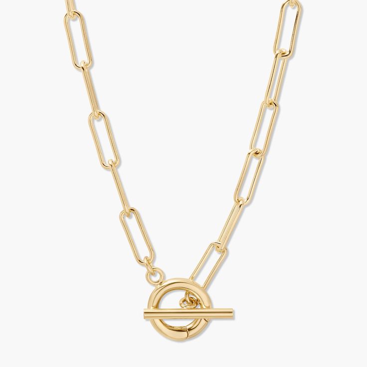 Treat yourself to something special with our Colette Charm Toggle Necklace. Crafted with a paperclip chain and romantic charms dangling from it, this piece will add a touch of glamour and style to your look. Add a touch of femininity to your day with this unique and eye-catching accessory. Available in 14k gold plated brass Chain width: 5mm 17.5" elongated link paperclip chain 1/2" hinge clasp Toggle closure SKU: BYN1277 Stackable Necklaces, Modern Jewellery Design, Toggle Necklace, Monogram Necklace, Metal Necklaces, Brass Chain, Modern Jewelry, Treat Yourself, Something Special