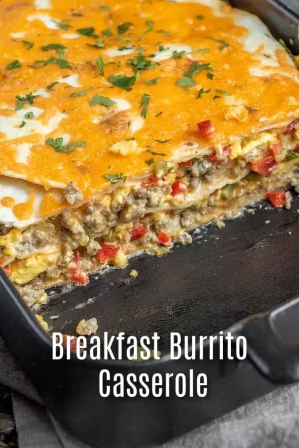 breakfast burrito casserole in a black pan with text overlay that reads breakfast burrito casserole