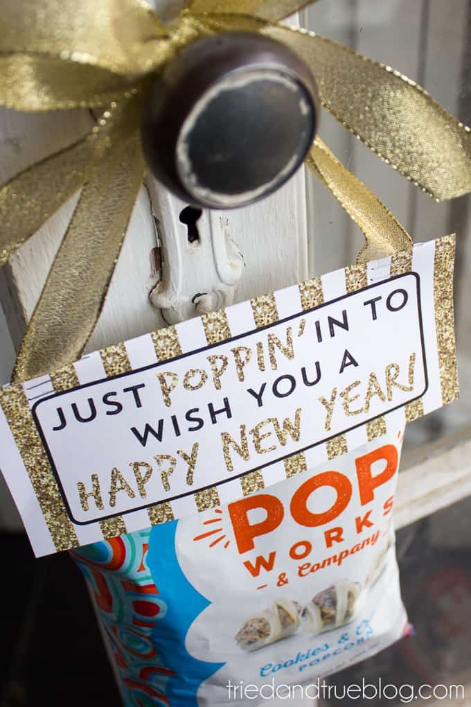 a new year's card tied to a fire hydrant with a gold bow