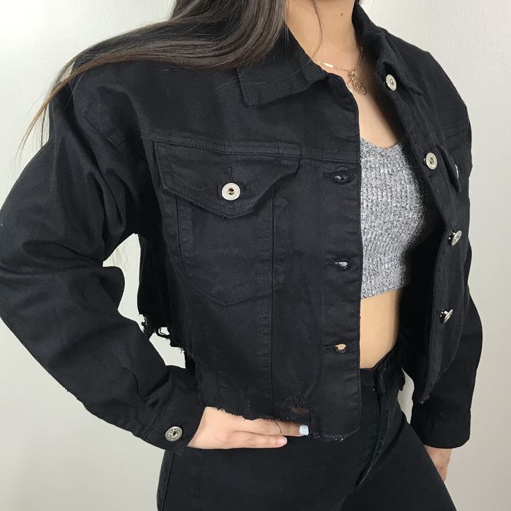 New Never Used Black Distressed In The Bottom Denim Over Size Jacket A Little Crop. Model Wearing Small Trendy Distressed Black Outerwear, Edgy Button-up Denim Jacket For Spring, Edgy Cropped Jacket With Pockets For Spring, Trendy Distressed Black Denim Jacket, Trendy Black Distressed Denim Jacket, Black Fitted Cotton Cropped Jacket, Black Denim Outerwear With Frayed Hem, Trendy Black Ripped Denim Jacket, Casual Black Ripped Outerwear