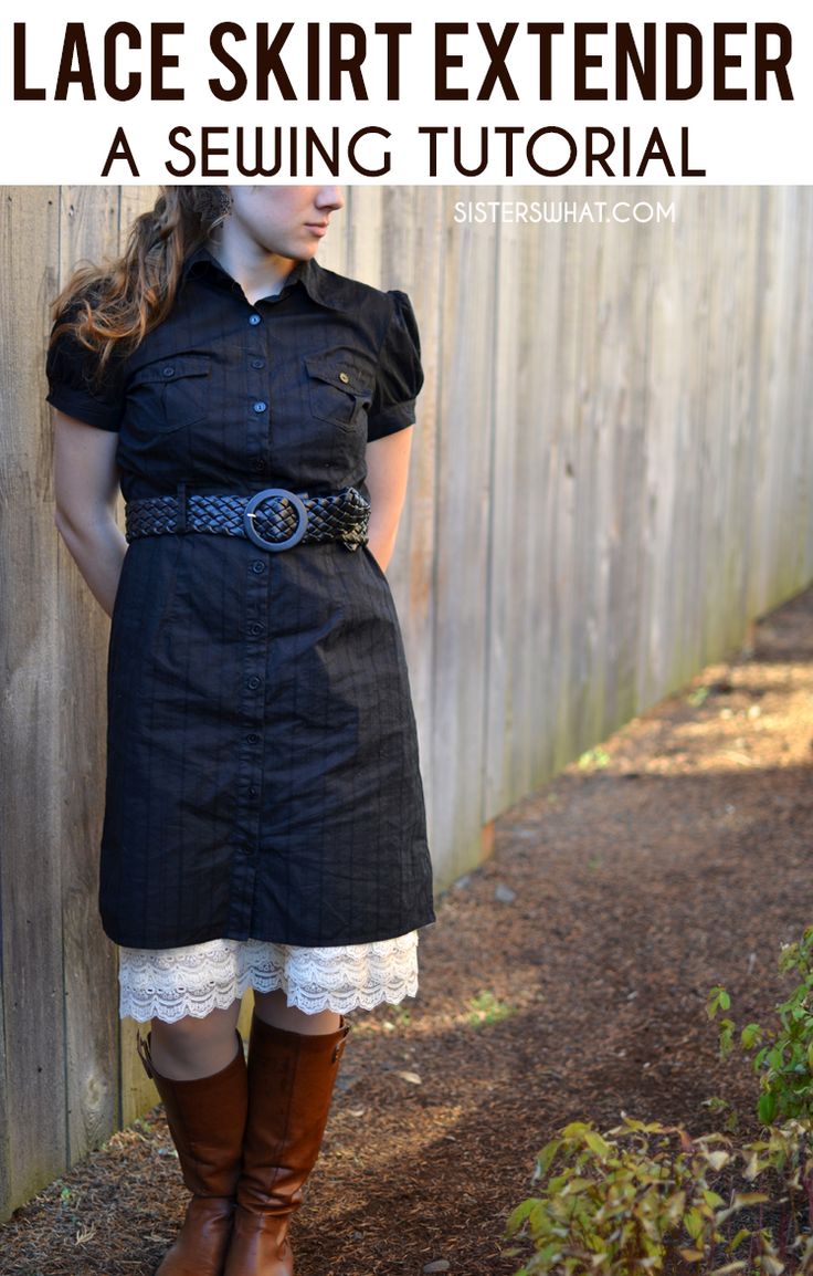 a woman standing in front of a fence wearing boots and a dress with lace skirt extender