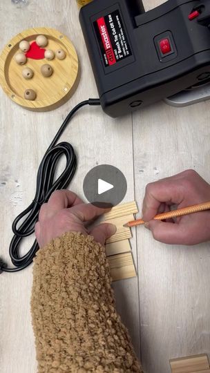 a person is working on something with a pencil