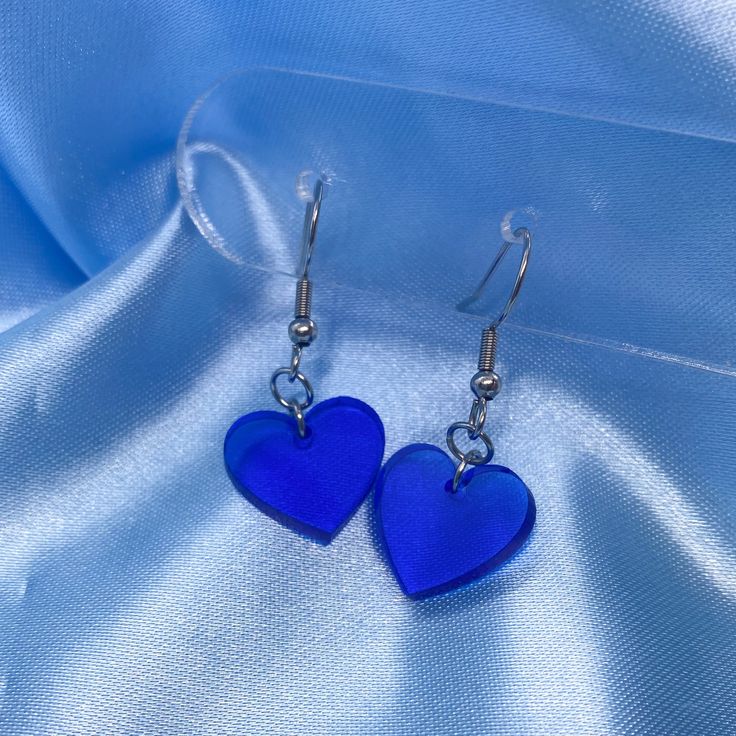 These mini clear blue hearts are simple, yet cute! These earrings have been designed and laser cut by us. Approximate Dimensions (Including Stud):Height: 2.5cm, Width: 2.7cmMaterial: Acrylic Care instructions: For best results, please keep these away from water, perfume and other chemicals. Store in a cool, dry place. Disclaimer: Our earring hooks are typically friendly on the skin, however they may not be suitable for hyper-sensitive and hyper-allergic skin. This includes our stainless steel and sterling silver earrings. Clear Heart, Water Perfume, Blue Hearts, Valentines Day Hearts, Earring Hooks, Blue Heart, Heart Earrings, Sterling Silver Earrings, Chemicals