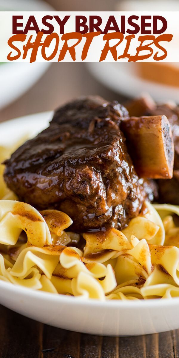 a white plate topped with meat and noodles