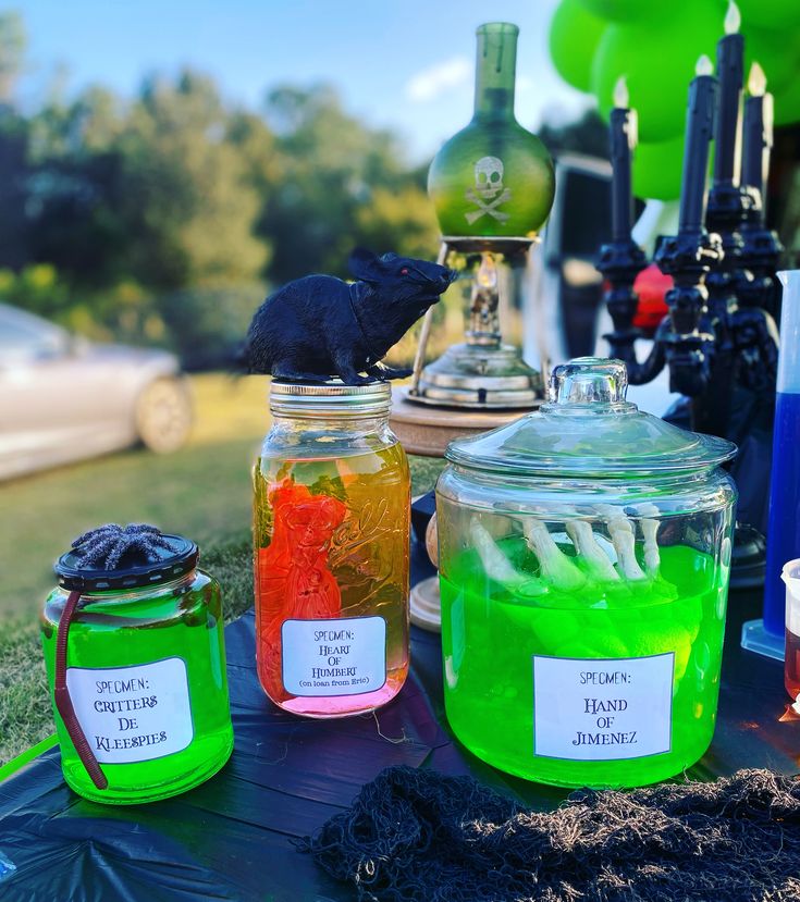 jars filled with liquid sitting on top of a table