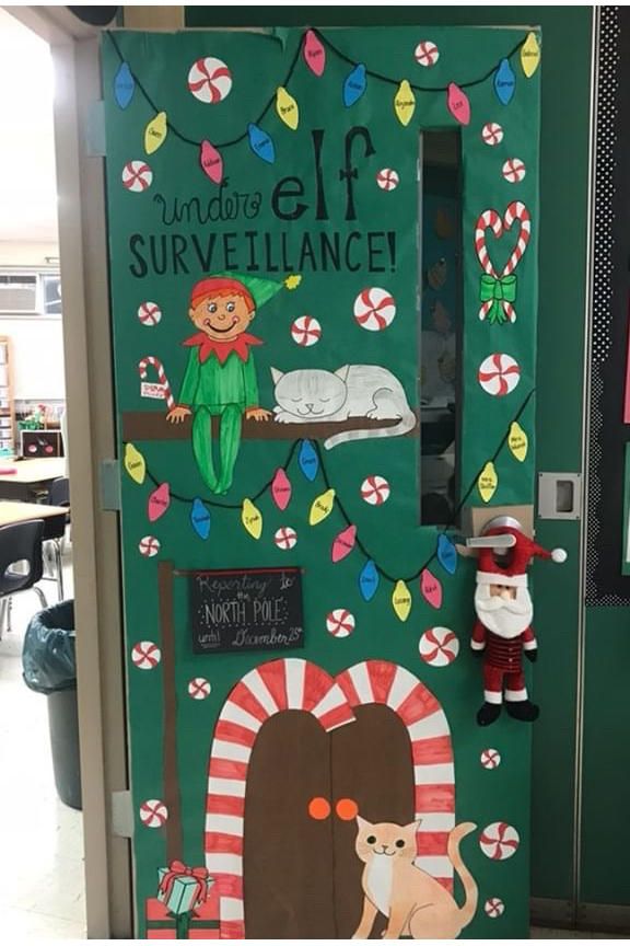 an elf door decorated with candy canes and christmas decorations