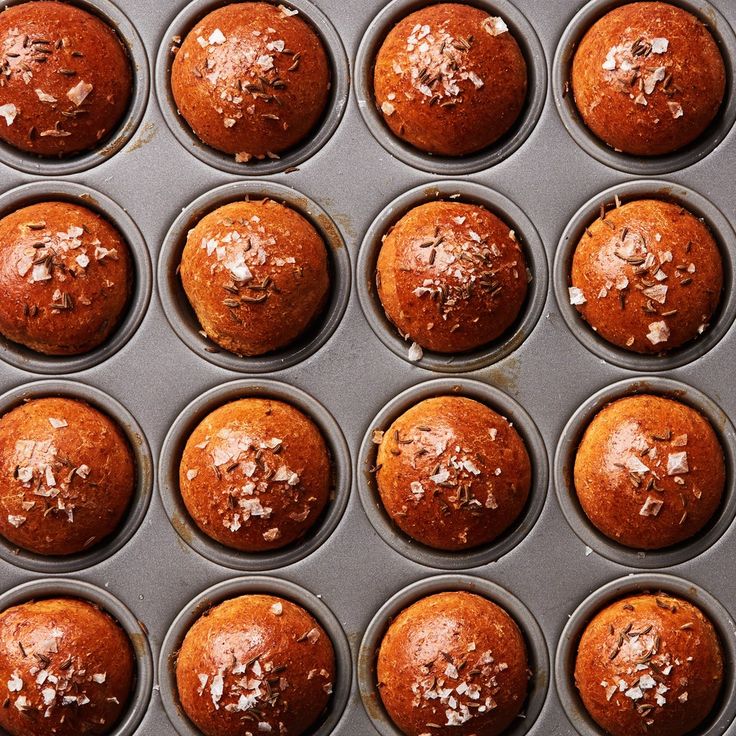 muffins in a pan with coconut on top