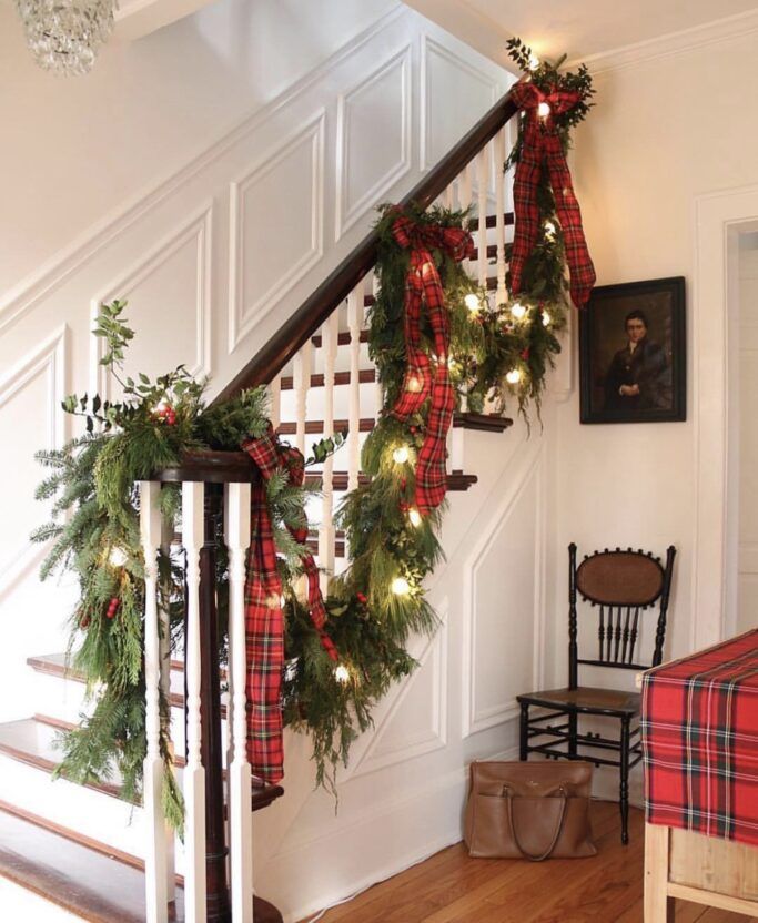 christmas garland and lights on the banister