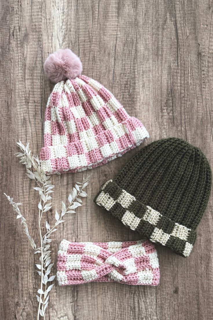 two knitted hats and one crochet hat on a wooden surface