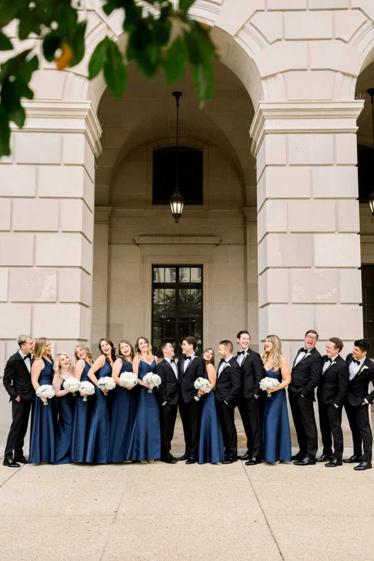 a large group of people standing in front of a building