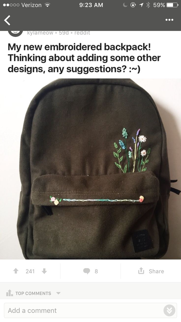 the back pack has flowers embroidered on it