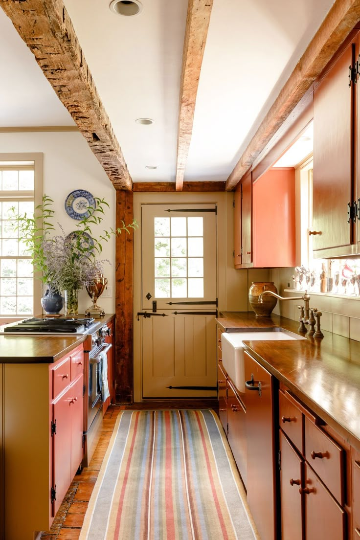 the kitchen is clean and ready for us to use it's natural wood accents