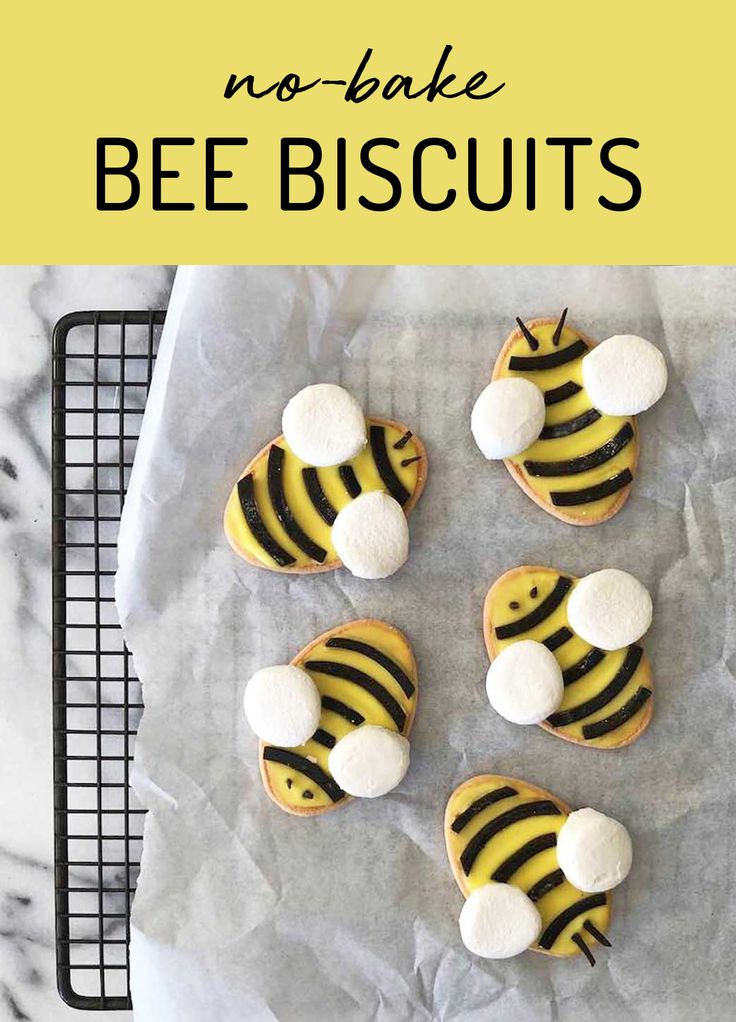 cookies decorated with yellow and black stripes on a baking sheet, ready to be baked