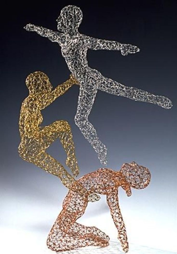 three different colored figures are shown in the shape of two people, one standing up and one sitting down