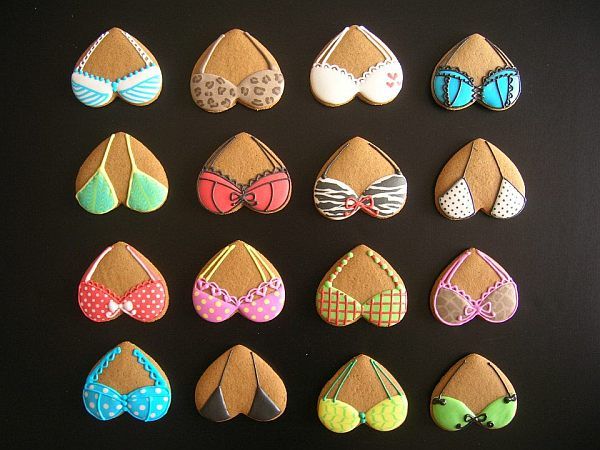 there are many decorated cookies in the shape of women's bras and shoes